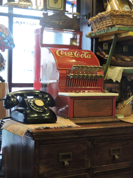 vintage Coca-cola cash machine in totoro decorated cafe in Osaka